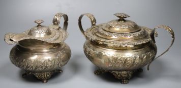 A George IV embossed silver lidded sugar bowl and matching cream jug, Joseph Angell I, London, 1823,