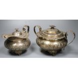 A George IV embossed silver lidded sugar bowl and matching cream jug, Joseph Angell I, London, 1823,