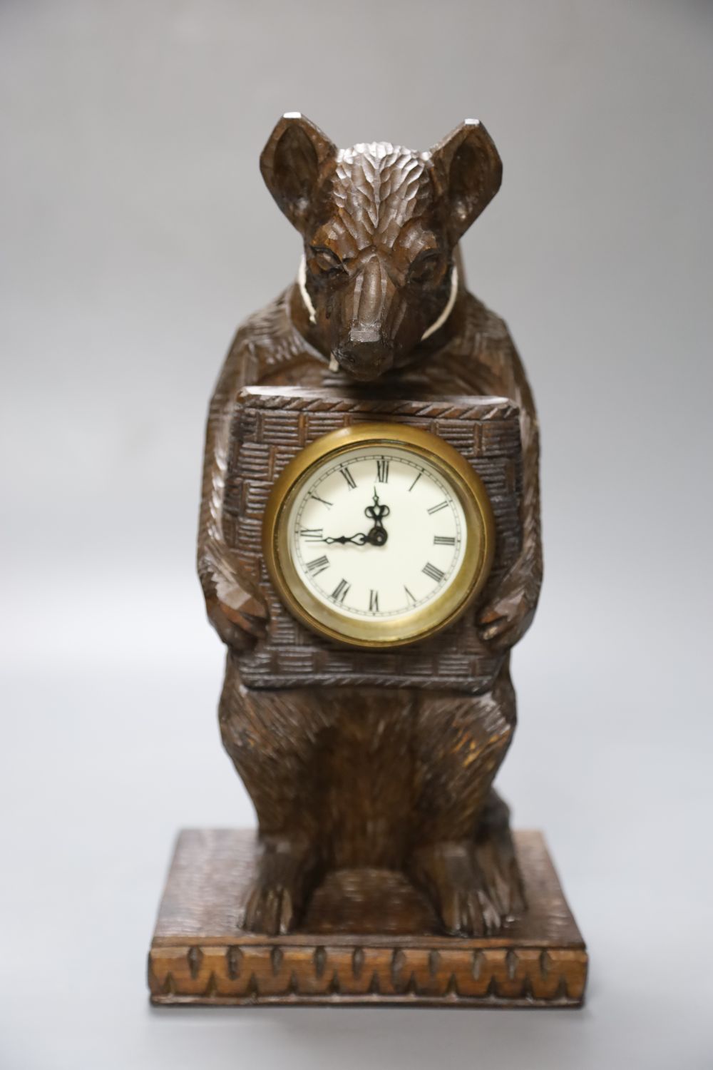 A modern carved pine bear timepiece in Black Forest style, 13cmCONDITION: Good condition