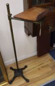 A late Victorian brass and cast iron adjustable lectern, with an oak reading slope, height 124cm