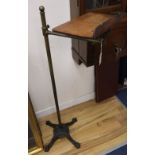 A late Victorian brass and cast iron adjustable lectern, with an oak reading slope, height 124cm