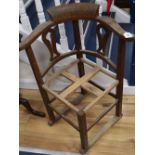 An early 20th century oak framed corner chair c.1900, inscribed 'This Chair is made from tree felled