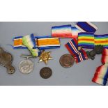 A quantity of medals and military badges