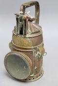 An R. Brown & Sons copper railway lamp, height 25cmCONDITION: Has fuel tank, burner and reflector.