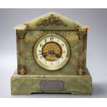 A late 19th century onyx cased eight day mantel clock, French gong-striking movement, presented