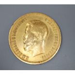 A Russian 1900 10 rouble gold coin, 8.7 grams.