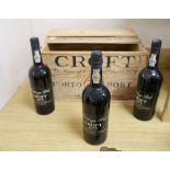 Three bottles of Croft 1975 Vintage Port, contained within original pine case