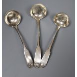 Three Scottish silver fiddle and shell pattern cream ladles, including a pair by John Zeigler,