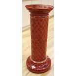 A Burmantofts plum glazed earthenware pedestal, 87cm high