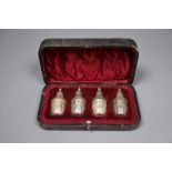 A cased set of four late Victorian silver pepper pots, Atkin Brothers, Sheffield 1897, 56mm.