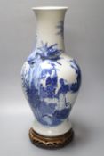 A 19th century Chinese porcelain blue and white vase and stand, neck sprigged with a serpent, on