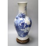 A 19th century Chinese porcelain blue and white vase and stand, neck sprigged with a serpent, on