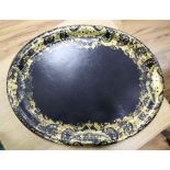 A Victorian oval papier mache tray, width 64cmCONDITION: Some chips around edge, clearly visible;