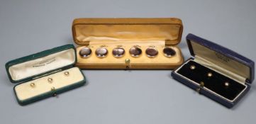 Six 9ct dress studs in two cases and one other cased set of six dress studs, 9ct- gross 3.4 grams.,