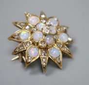 An Edwardian yellow metal, opal and diamond set flower head brooch, 25mm, gross 6.9 grams.