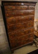 An early 18th century banded walnut tallboy, with oak sides, width 108cm depth 55cm height 180cm