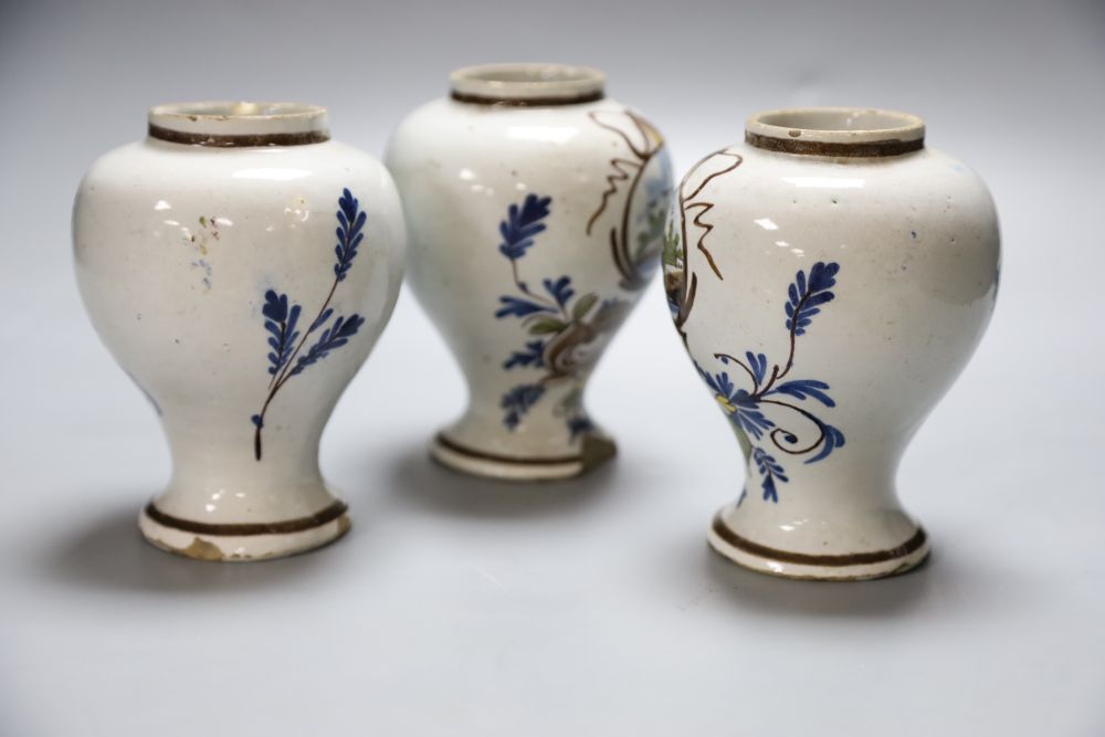 A set of three 19th century Dutch delft baluster jars, painted in colours, 14cmCONDITION: One jar - Image 2 of 4