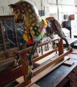 An Ayres-type rocking horse on wooden frame, length 130cm height 108cm (a.f.)