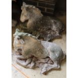 A pair of reconstituted stone recumbent horse garden ornaments, length 62cm