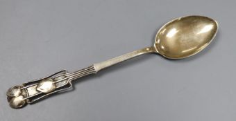 An Edwardian Art Nouveau Liberty & Co Cymric silver coffee spoon, with stylised terminal,