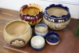 Two Doulton stoneware jardinieres, three similar small pots and a Bretby jardiniere (6)