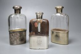 Two Victorian silver mounted glass hip flasks and a George V silver mounted glass hip flask, tallest