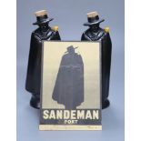 A pair of Doulton figural Sandeman port flasks (empty)CONDITION: Figures good; advertising panel