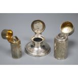 A silver capstan inkwell and two silver-cased cylindrical scent bottles with hinged lids, the larger