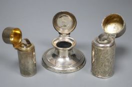 A silver capstan inkwell and two silver-cased cylindrical scent bottles with hinged lids, the larger