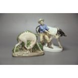 A Royal Copenhagen deer, model 2051 and a Sitzendorf figure group of a man and a cow.CONDITION: Good