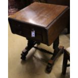 A William IV rosewood drop-flap sewing table, fitted two frieze drawers, carved with acanthus to end