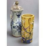 A Chinese blue and white converted lamp, together with a yellow ground cylindrical vase, tallest