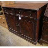 An early Victorian mahogany cabinet, fitted two drawers over panelled doors, width 114cm depth
