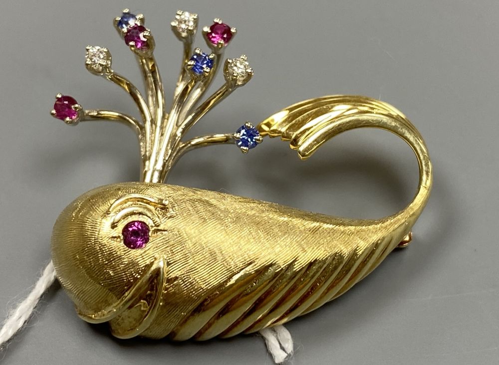A novelty continental yellow metal (engraved 14k), ruby diamond and sapphire set 'happy' whale