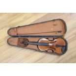 A ate 19th century German violin labelled "Heinrich Schwartz Leipzig 1894" cased with a bow