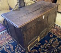 An 18th century panelled oak mule chest, width 118cm, depth 56cm, height 72cm