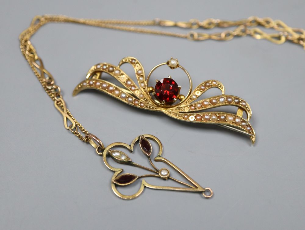 A 15ct, garnet and seed set brooch, 46mm, gross 4.3 grams and a 9ct pendant on a yellow metal