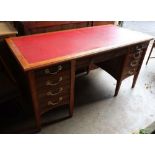 An Edwardian oak and walnut desk, width 160cm depth 74cm height 76cm