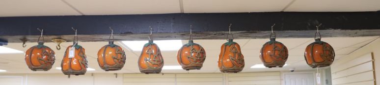 A collection of eight vintage glass and painted metal Halloween pumpkin lanterns, various