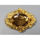 A Victorian pierced yellow metal and citrine set oval brooch, 47mm, gross 12.9 grams.CONDITION: