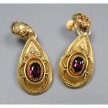 A pair of Victorian yellow metal and garnet set pear shaped drop ear clips, 38mm, gross 5.7 grams.