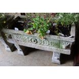 A reconstituted stone rectangular garden planter on trestle stand, length 92cm height 58cm