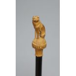A pipe pamper with dog finial
