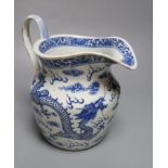 A 19th century Chinese blue and white dragon jug, 22cmCONDITION: Crack inward from pouring lip,