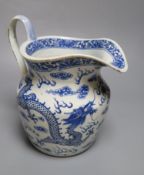 A 19th century Chinese blue and white dragon jug, 22cmCONDITION: Crack inward from pouring lip,