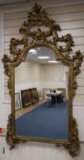 An 18th century style rococo gilt framed wall mirror, width 108cm height 184cm