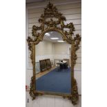 An 18th century style rococo gilt framed wall mirror, width 108cm height 184cm