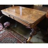 A William IV rosewood centre table, the top with rounded corners and dentil-moulded edge, on lion'