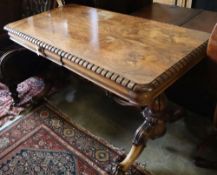 A William IV rosewood centre table, the top with rounded corners and dentil-moulded edge, on lion'