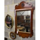 A George III style fret cut wall mirror and two others, tallest 102cm